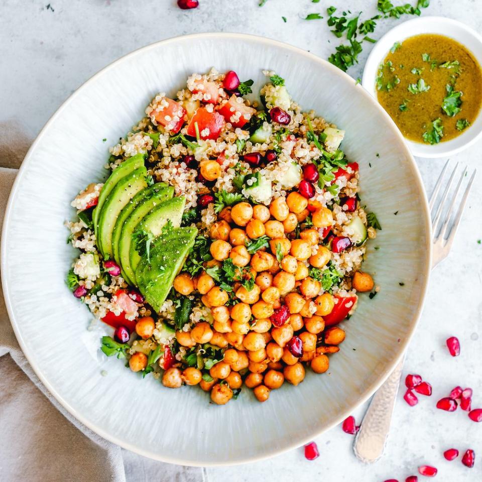 surprising sources of fruit and veg, quinoa chickpea salad with tomato, cucumber, pomegranate and avocado