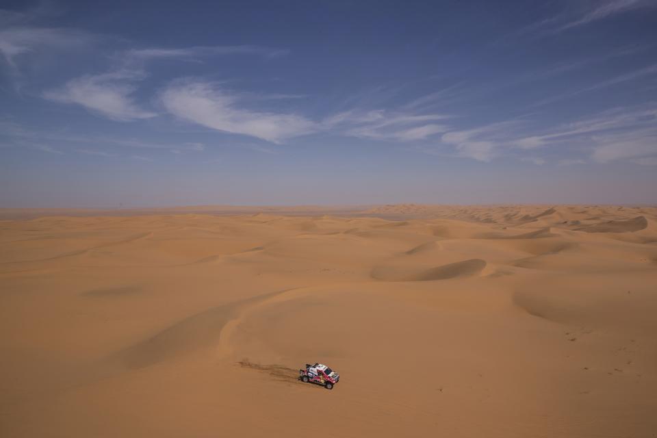 In this Sunday, Jan. 12, 2020 photo, driver Giniel De Villers, of South Africa, and co-driver Alex Haro, of Spain, race their Toyota during stage seven of the Dakar Rally between Riyadh and Wadi Al Dawasir, Saudi Arabia. Formerly known as the Paris-Dakar Rally, the race was created by Thierry Sabine after he got lost in the Libyan desert in 1977. Until 2008, the rallies raced across Africa, but threats in Mauritania led organizers to cancel that year's event and move it to South America. It has now shifted to Saudi Arabia. The race started on Jan. 5 with 560 drivers and co-drivers, some on motorbikes, others in cars or in trucks. Only 41 are taking part in the Original category. (AP Photo/Bernat Armangue)