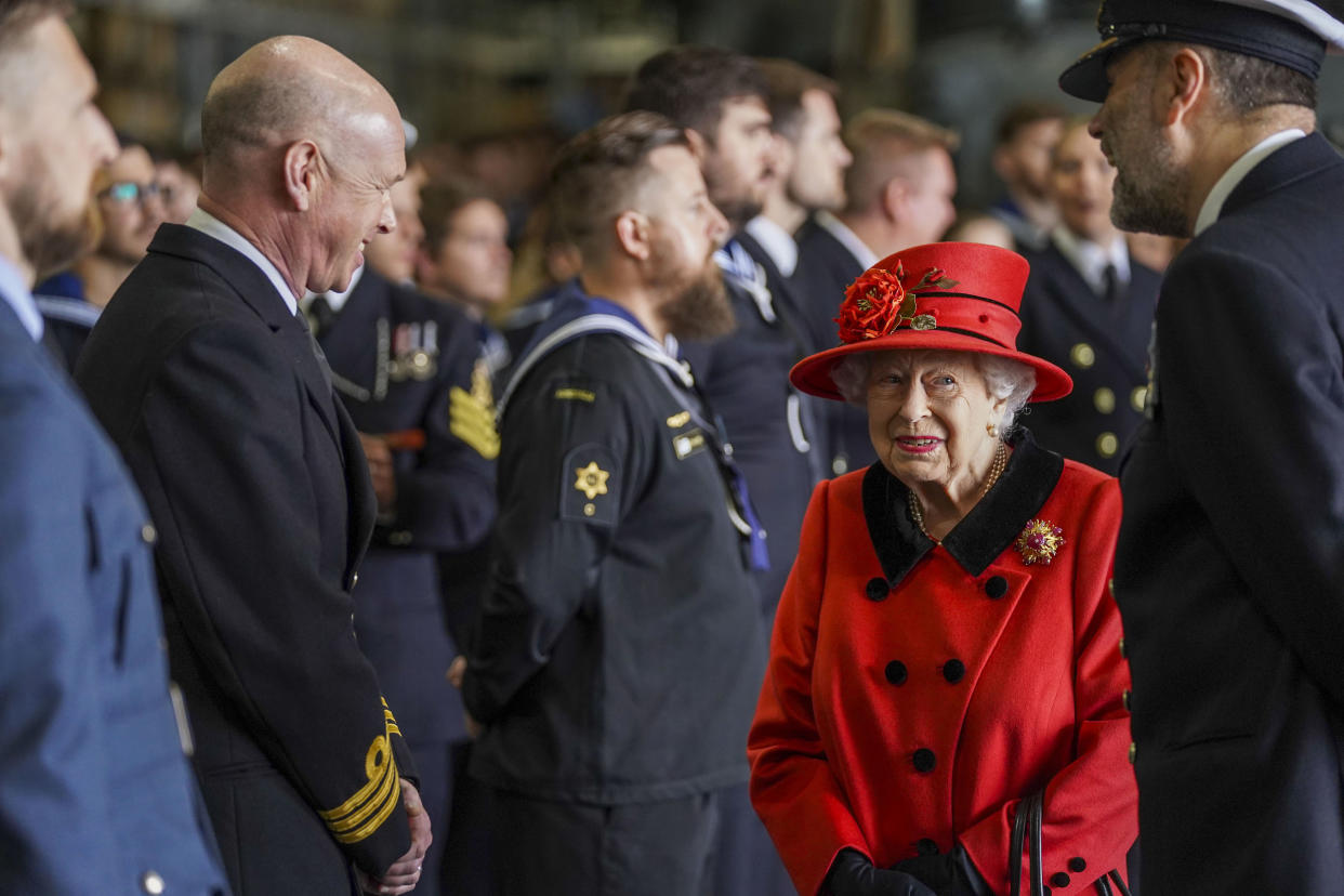 PORTSMOUTH, ENGLAND - MAY 22: Queen Elizabeth II during a visit to HMS Queen Elizabeth at HM Naval Base ahead of the ship's maiden deployment on May 22, 2021 in Portsmouth, England. The visit comes as HMS Queen Elizabeth prepares to lead the UK Carrier Strike Group on a 28-week operational deployment travelling over 26,000 nautical miles from the Mediterranean to the Philippine Sea. (Photo by Steve Parsons - WPA Pool / Getty Images)