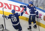 Tampa Bay Lightning's Ondrej Palat (18) and Otto teammate Koivula (21) celebrate a goal during second-period NHL Eastern Conference final playoff game action against the New York Islanders in Edmonton, Alberta, Monday, Sept. 7, 2020. (Jason Franson/The Canadian Press via AP)