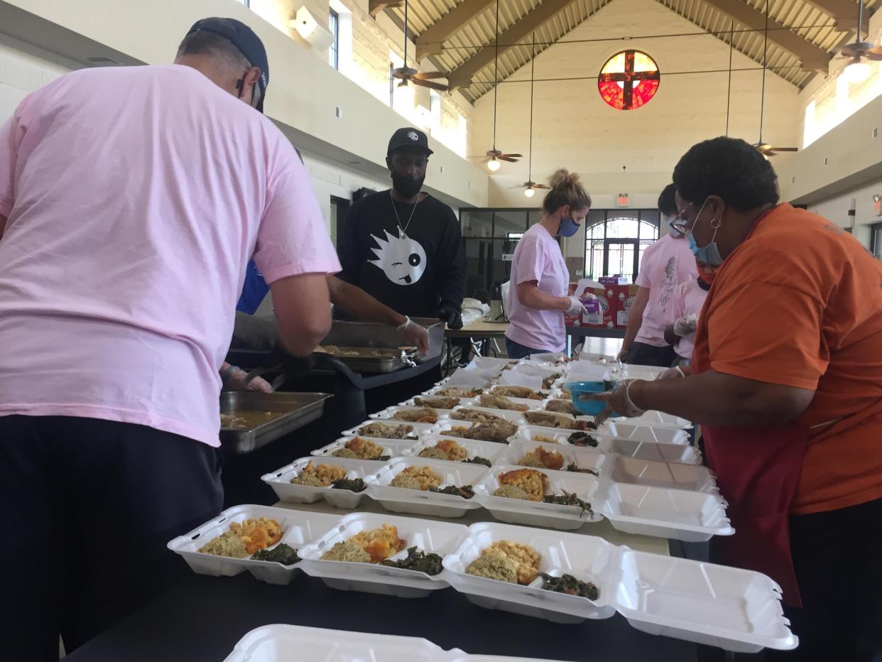 Volunteers at the Master's Table Soup Kitchen prepare 300 boxed Thanksgiving meals for guests in need Thursday, Nov. 26, 2020.