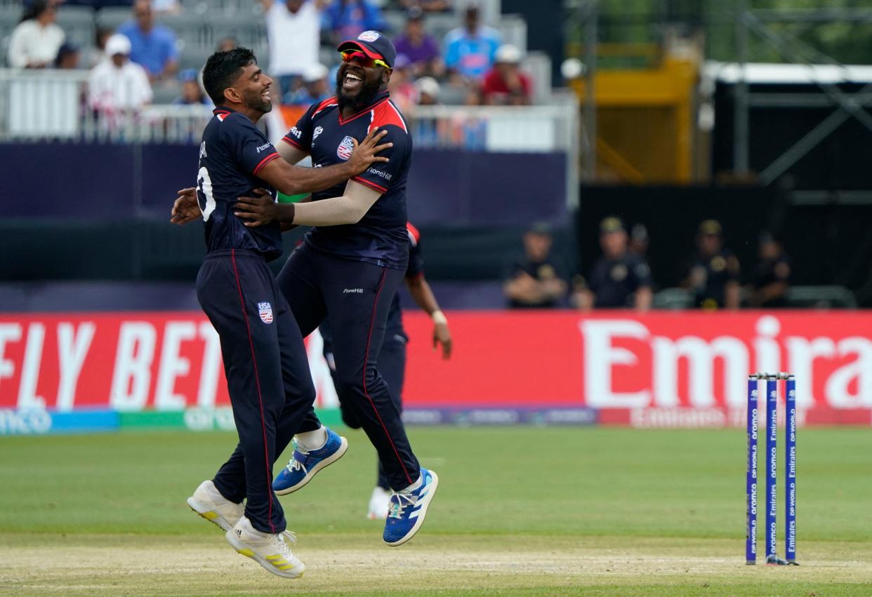 USA's Saurabh Netravalkar (L) celebrates with teammate Steven Taylor after dismissing India's Virat Kohli during the ICC men's Twenty20 World Cup 2024 group A cricket match between the USA and India at Nassau County International Cricket Stadium in East Meadow, New York on June 12, 2024. (Photo by TIMOTHY A. CLARY / AFP) (Photo by TIMOTHY A. CLARY/AFP via Getty Images)