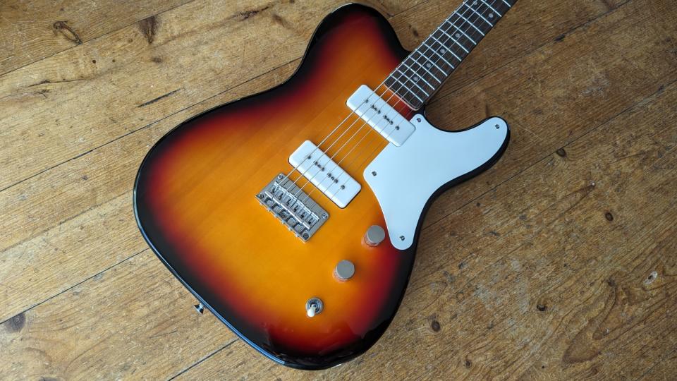 A Squier Paranormal Baritone Cabronita Telecaster on a wooden floor