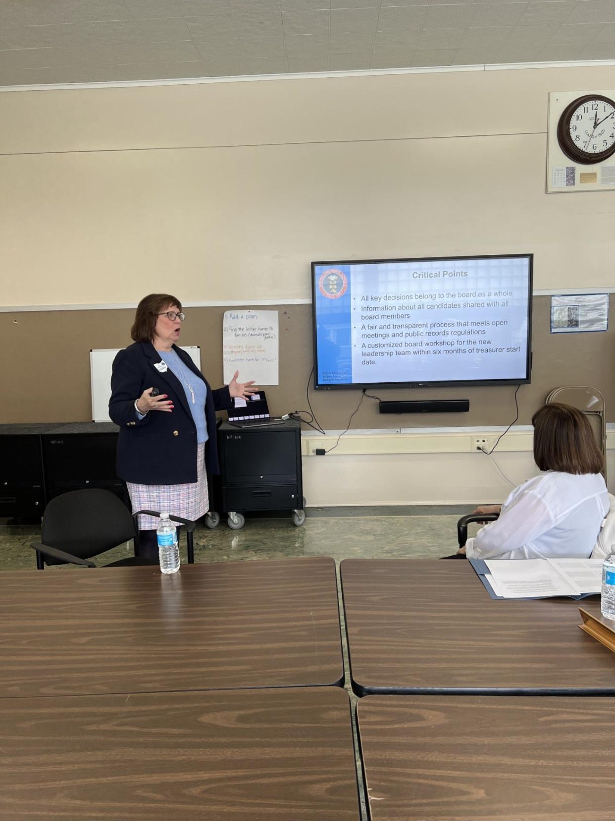 Teri Morgan of the Ohio School Boards Association gives a presentation to the Ravenna Board of Education on the selection process the board would go through if the board picks the OSBA to select its next treasurer.