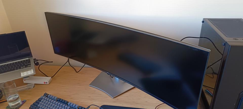 A Dell UltraSharp U4924DW monitor sitting on a desk