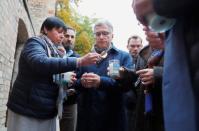 People light candles outside the synagogue in Halle