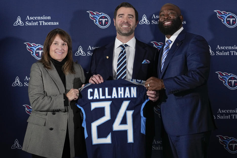 Tennessee Titans new head football coach Brian Callahan, center, poses with controlling owner Amy Adams Strunk, left, and general manager Ran Carthon, right, following Callahan's introductory news conference at the NFL team's training facility Thursday, Jan. 25, 2024, in Nashville, Tenn. (AP Photo/George Walker IV)