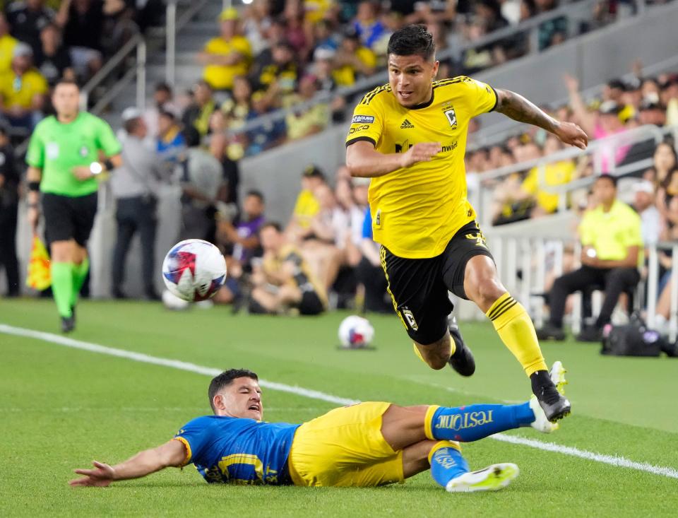 Crew forward Cucho Hernandez gets around Club America midfielder Richard Sanchez on Monday.