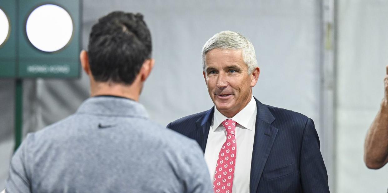 atlanta, georgia august 24 pga tour commissioner jay monahan smiles as he greets rory mcilroy of northern ireland at a press conference prior to the tour championship, the third and final event of the fedexcup playoffs, at east lake golf club on august 24, 2022 in atlanta, georgia photo by keyur khamarpga tour via getty images