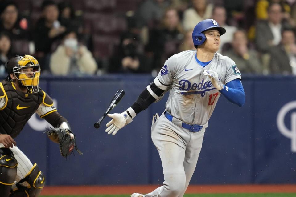 Shohei Ohtani bats against the San Diego Padres during the Dodgers' season opener in South Korea.