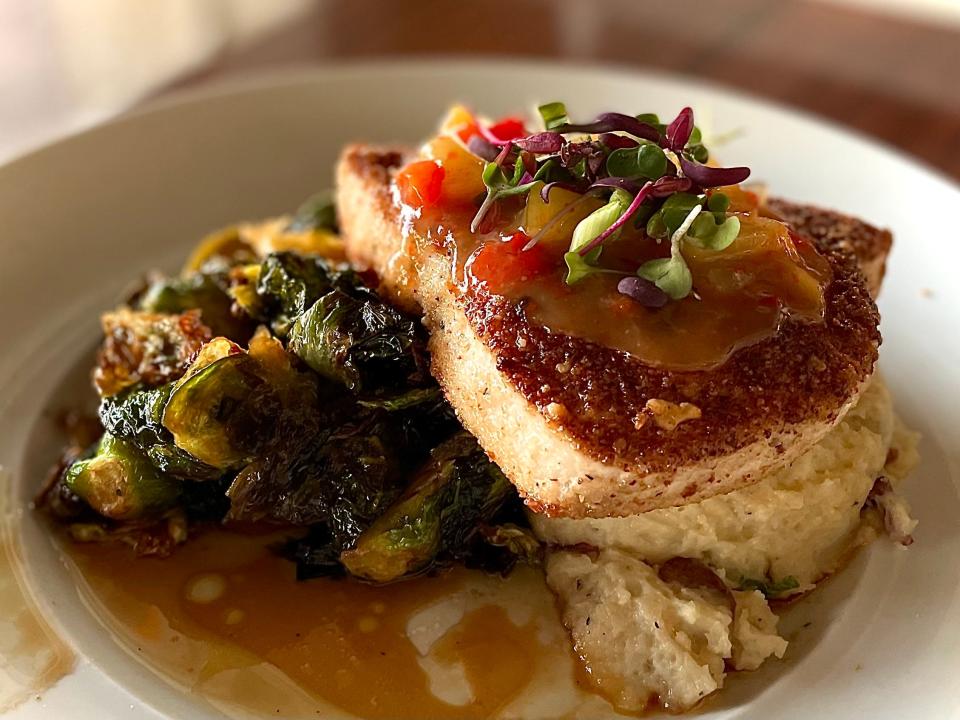 Walnut-encrusted swordfish and Brussels sprouts from Outriggers Tiki Bar and Grille in New Smyrna Beach.