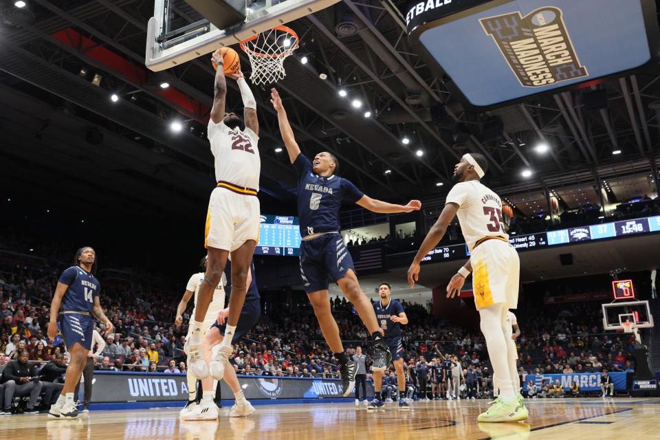 Warren Washington of Arizona State dunks the ball against Darrion Williams of Nevada during the second half in the First Four game of the NCAA Men's Basketball Tournament at University of Dayton Arena on March 15, 2023 in Dayton, Ohio