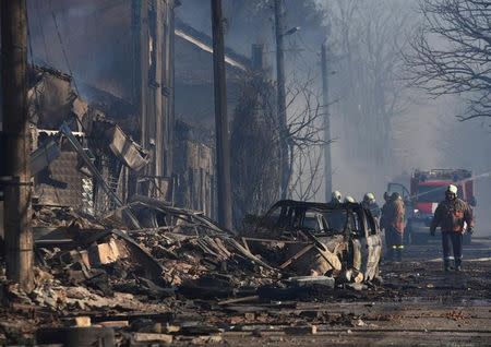 Firefighters work on the site where a cargo train derailed and exploded in the village of Hitrino, Bulgaria, December 10, 2016. Impact Press Group/Petko Momchilov/via REUTERS