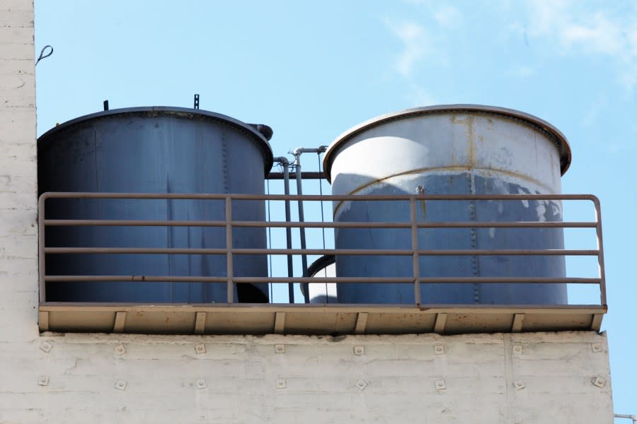 This Thursday, Feb. 21, 2013 photo shows water tanks on the roof of the Cecil Hotel in Los Angeles. Canadian tourist Elisa Lam had been missing for about two weeks when officials at the Cecil Hotel found her body in a water cistern on the hotel roof. Guest complaints about low water pressure prompted a maintenance worker to make the gruesome discovery Tuesday, and officials were trying to determine if the 21-year-old was killed or if her death was a bizarre accident. (AP Photo/Damian Dovarganes)