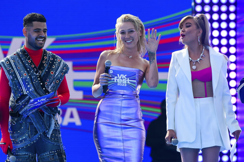 FILE - TV presenter and actress Anastasia Ivleeva, center, performs during VK Festival in Moscow, Russia, on July 15, 2023. A court in Moscow on Wednesday, Jan 10, 2024, turned back a class-action lawsuit against a Russian TV presenter that sought $11 million in moral damages for her hosting a party where guests were encouraged to show up wearing next to nothing. The suit against Anastasia Ivleeva was one element of a scandal that erupted after her bash at a Moscow nightclub and sent a well-known rapper who attended wearing only a sock around his genitals and two on his feet to jail. (AP Photo, File)