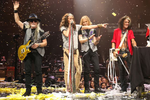 <p>Kevin Mazur/Getty</p> Brad Whitford, Steven Tyler, Tom Hamilton and Joe Perry performing on Sept. 9