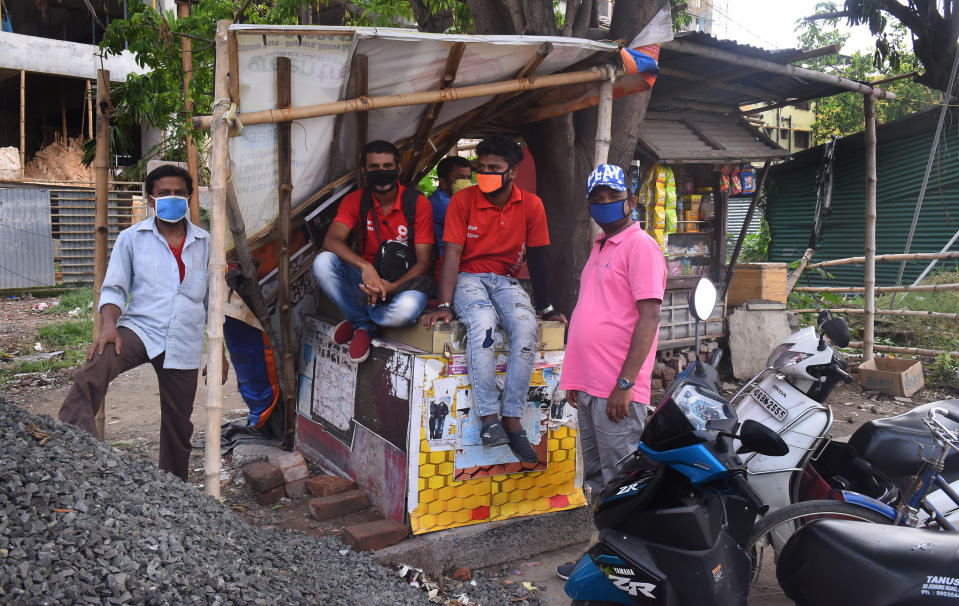 KOLKATA, June 8, 2020 -- Food delivery men wait near a restaurant in Kolkata, India on June 8, 2020. The fifth phase of lockdown began on June 1 in India, though with several relaxations for reopening of economic activities. The current phase is also dubbed as "Unlock 1.0" as the fresh guidelines allow reopening of several places like shopping malls, religious places, manufacturing activities, offices and other business establishments. (Xinhua via Getty) (Xinhua/Stringer via Getty Images)