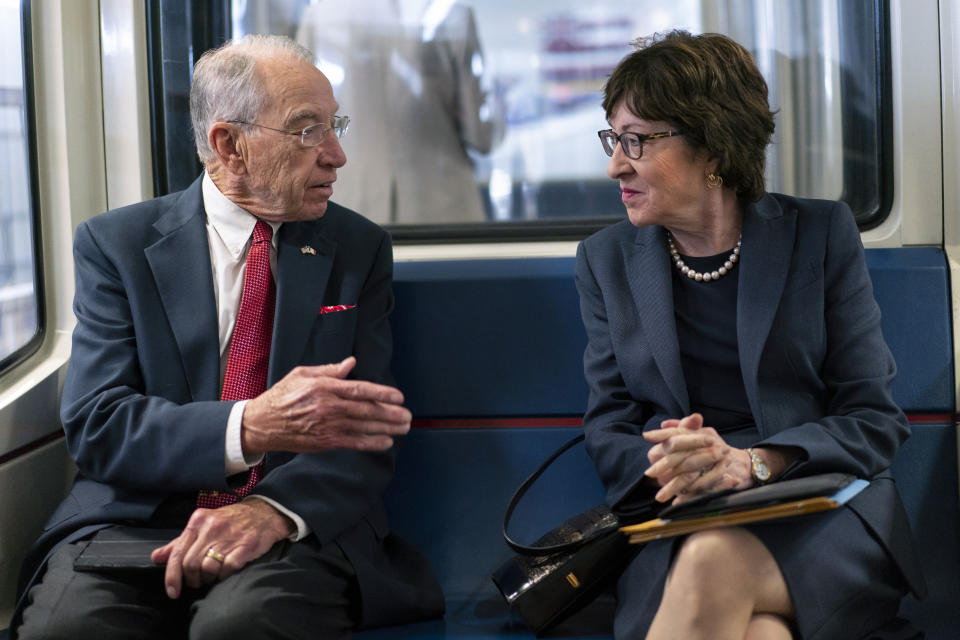 Sen. Chuck Grassley, R-Iowa, and Sen. Susan Collins, R-Maine, talk on the subway on Capitol Hill in Washington, Thursday, Nov. 4, 2021. (AP Photo/Carolyn Kaster)