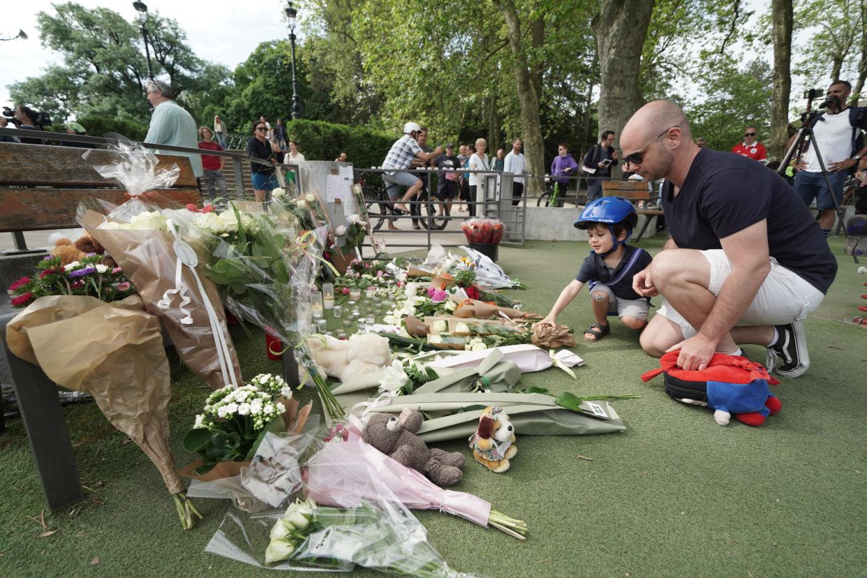 People have laid floral tributes and teddy bears at the scene of the attack (PA Wire)