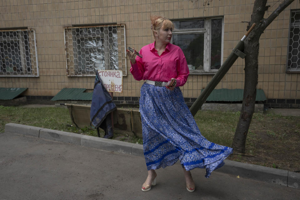 Medic volunteer Nataliia Voronkova speaks to soldiers as she delivers medical aid to a hospital, in Kurakhove, Donetsk region, eastern Ukraine, Thursday, July 21, 2022. Voronkova has dedicated her life to aid distribution and tactical medical training for soldiers and paramedics, working on front line of the Donetsk region since the war began in 2014. (AP Photo/Nariman El-Mofty)