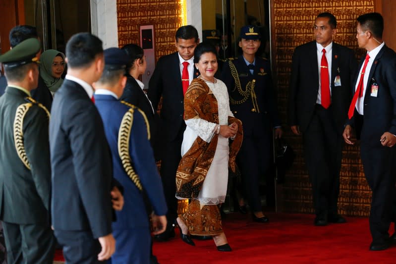 Indonesian First Lady Iriana Widodo arrives to attend the inauguration of Indonesia's President Joko Widodo for the second term, at the House of Representatives building in Jakarta