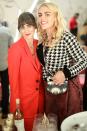 Jenn Streicher and Busy Philipps get together at the Streicher Sisters and PLUS Products Celebrate STRIIIKE Holiday Market at STRIIIKE in Beverly Hills on Thursday.