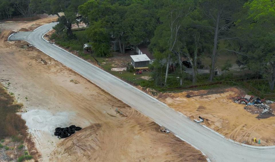 One of two homes is seen nestled among a forested area of land off Jonesville Road photographed on May 10, 2023 as construction of a residential development surrounds the Wright family property on Hilton Head Island. 
