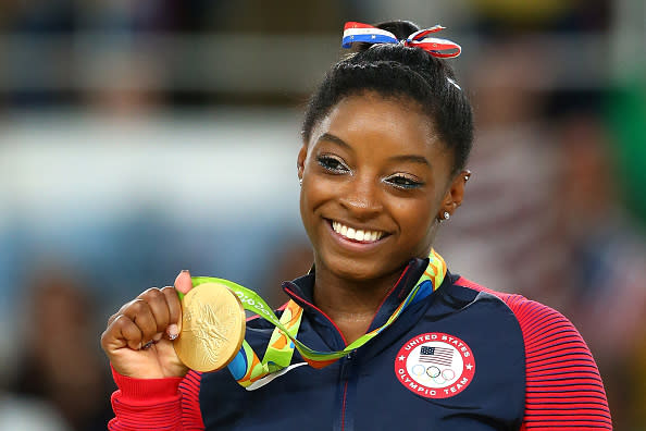 Simone Biles looks like a true Olympian with her gold medal and perfect smile on a Kellogg’s cereal box