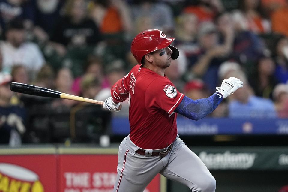 Cincinnati Reds' Spencer Steer hits a two-run home run against the Houston Astros during the sixth inning of a baseball game Sunday, June 18, 2023, in Houston. (AP Photo/David J. Phillip)