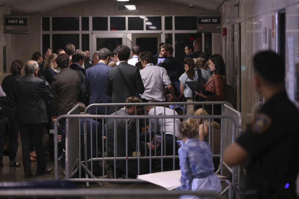 Members of the press and public stand outside the courtroom after being asked to leave by Judge Juan Merchan during former President Donald Trump's hush money trial at Manhattan Criminal Court, Monday, May 20, 2024 in New York. Judge Juan Merchan briefly kicked reporters out of the courtroom after admonishing defense witness Robert Costello for his behavior on the stand. (Photo by Michael M. Santiago/Getty Images)