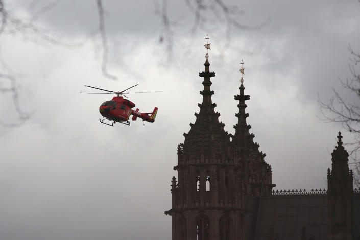 <p>London’s air ambulance arrives at the Houses of Parliament in central London on March 22, 2017 during an emergency incident.<br> Britain’s Houses of Parliament were in lockdown on Wednesday after staff said they heard shots fired, triggering a security alert. (Daniel Leal-Olivas /AFP/Getty Images) </p>
