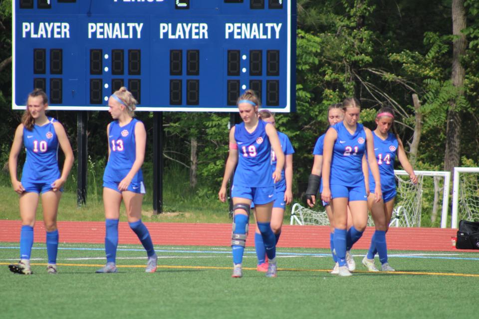 The Lenawee Christian girls soccer team walks onto the pitch for the second half of Friday's Division 4 district title game against Manchester at Ann Arbor Greenhills.