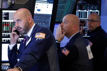 Traders work on the floor of the New York Stock Exchange (NYSE) in New York City, U.S., November 22, 2016. REUTERS/Brendan McDermid