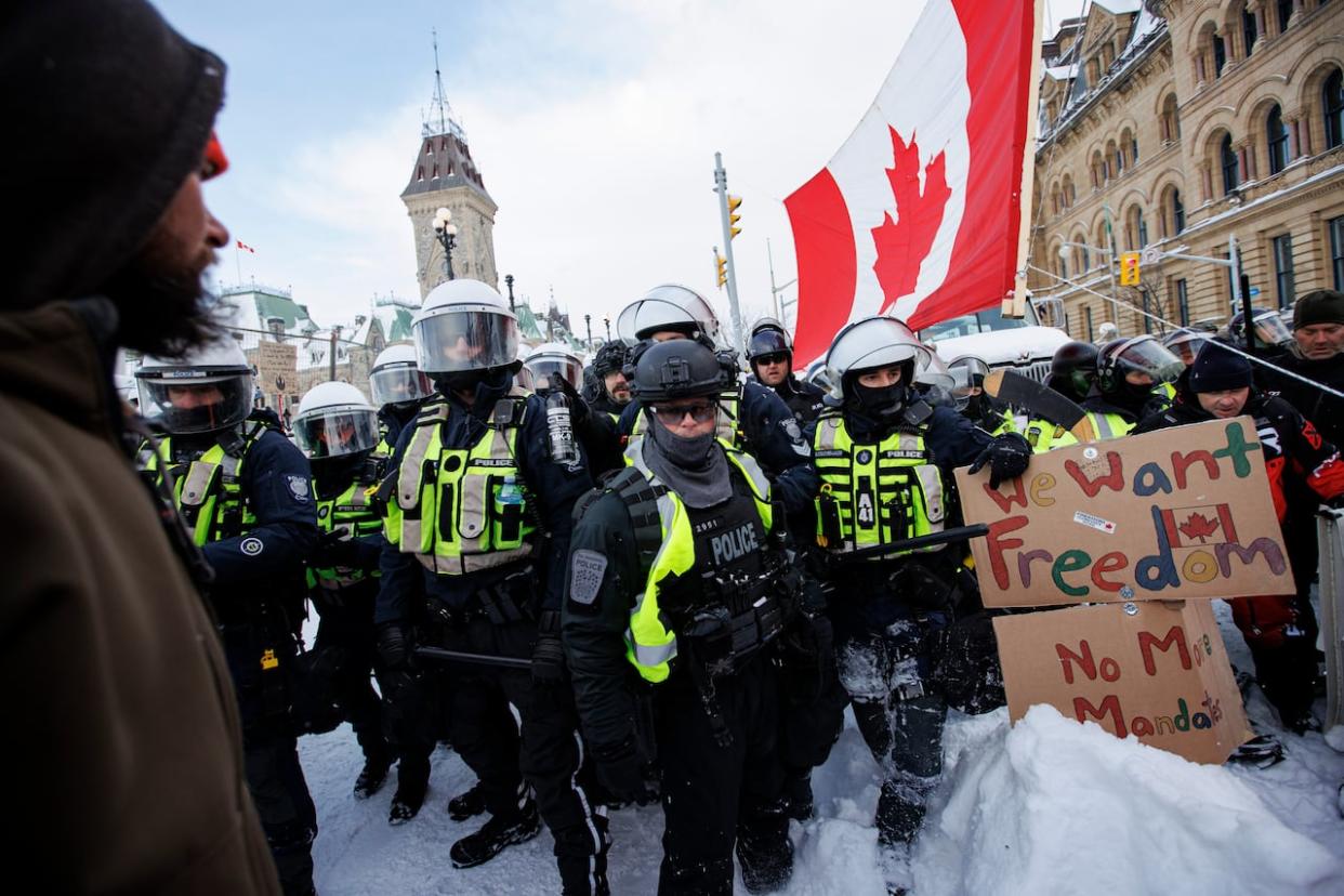 Police enforce an injunction against Freedom Convoy protesters, some who were camped in their trucks near Parliament Hill for weeks, on Feb. 19, 2022. (Evan Mitsui/CBC - image credit)