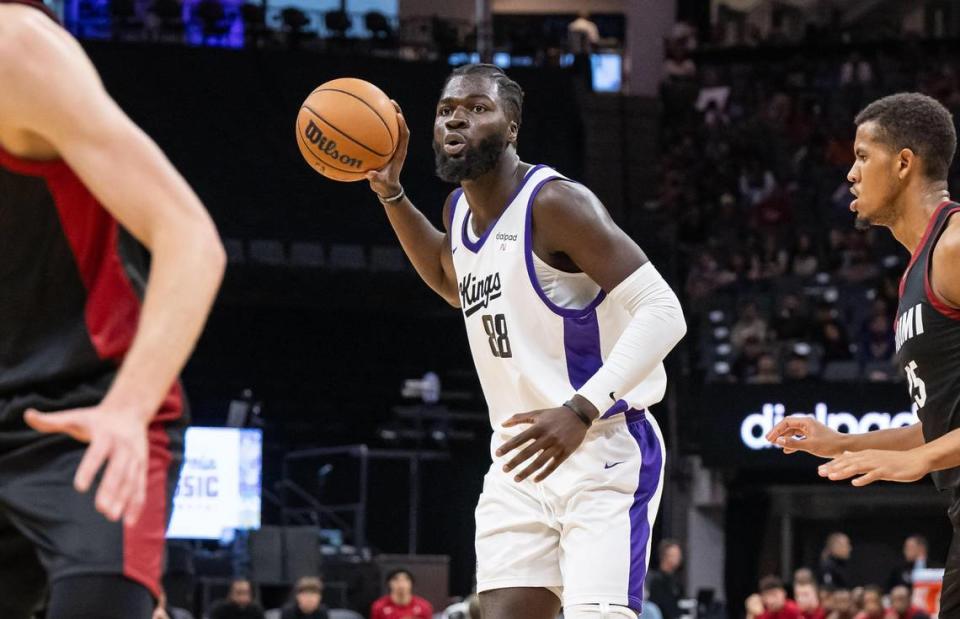 Sacramento Kings center Neemias Queta (88) looks for an open teammate as Miami Heat center Orlando Robinson (25) defends during a California Classic NBA summer league basketball game in July at Golden 1 Center.