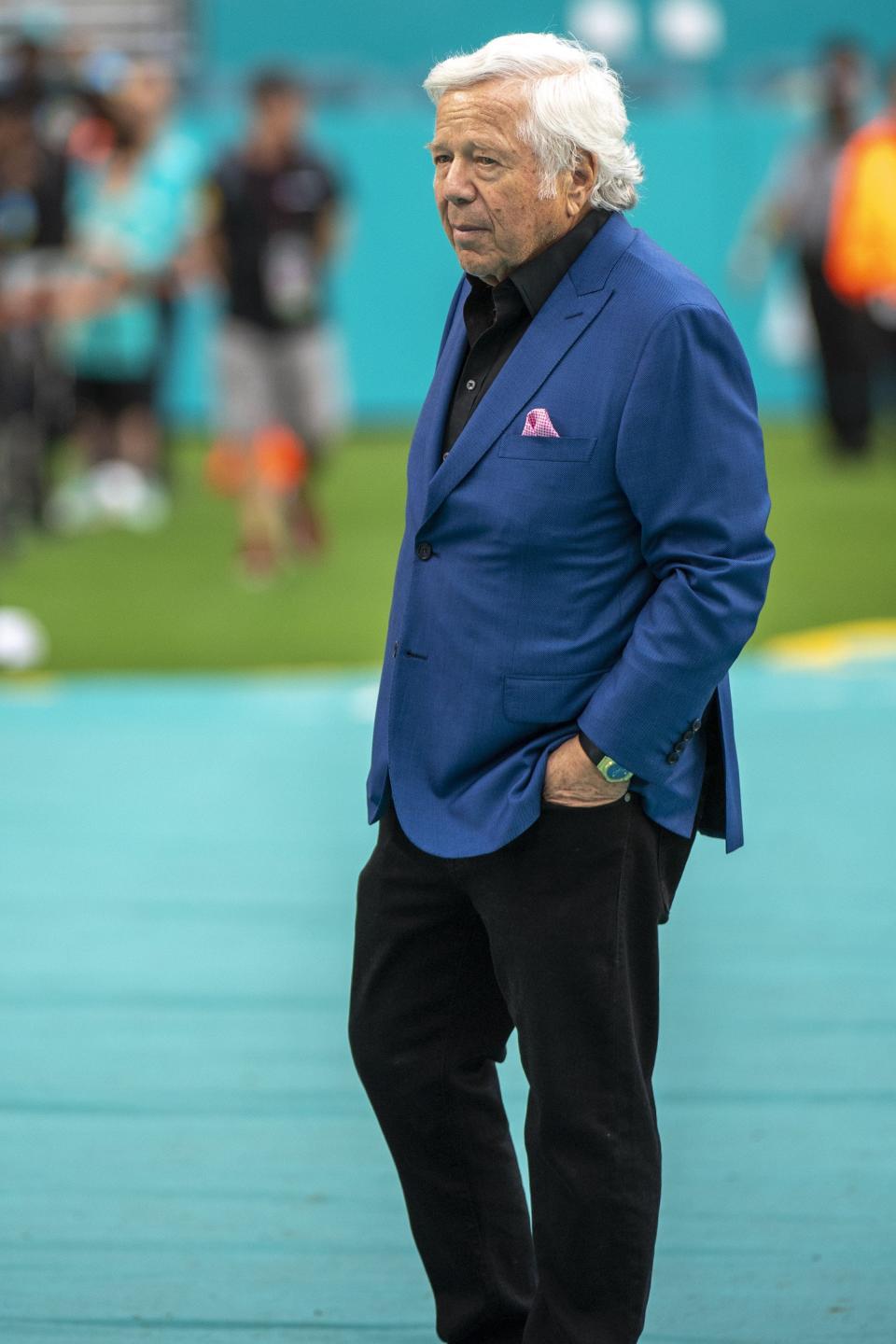 Patriots owner Robert Kraft stands on the sideline before a regular-season game in Miami.