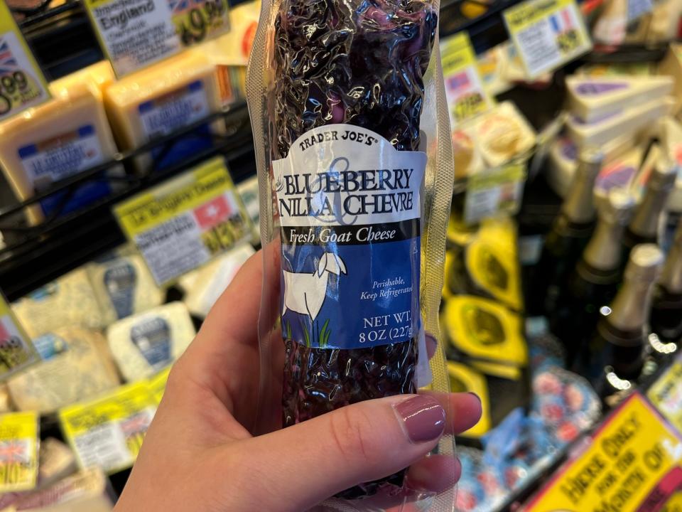 The writer holds blueberry goat cheese