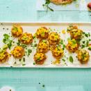 <p>Spoil guests with these savory crab cake bites, made with fresh sweet crab meat and topped with a crunchy mango-avocado relish that’s delicious enough to serve on its own.</p><p><em><a href="https://www.goodhousekeeping.com/food-recipes/a31018912/crab-cake-recipe/" rel="nofollow noopener" target="_blank" data-ylk="slk:Get the recipe for Crab Cakes With Mango-Avocado Relish »;elm:context_link;itc:0;sec:content-canvas" class="link ">Get the recipe for Crab Cakes With Mango-Avocado Relish »</a></em></p>