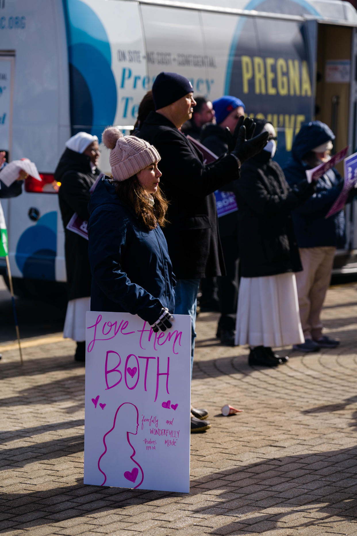 A woman holds a sign denouncing abortion during the March for Life in Chillicothe, Ohio, Saturday, Jan. 22, 2022.