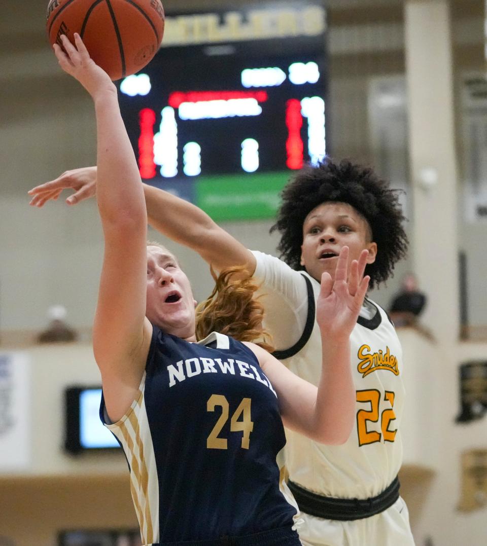 Norwell High School's Makenzie Fuess is defended by Fort Wayne Snider High School's Jordyn Poole (22) at Noblesville High School, Dec 28, 2023. Ft. Wayne Snyder won 65-50.