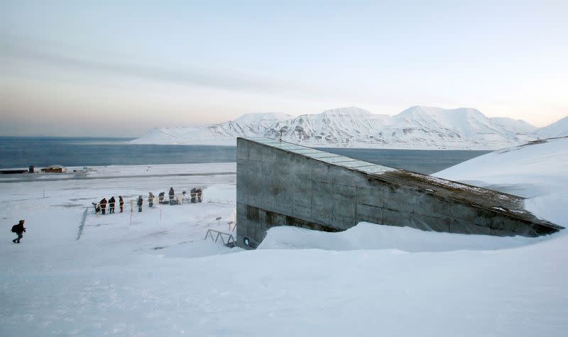 FILE PHOTO: Television crews stand outside the Global Seed Vault before the opening ceremony in Longyearbyen