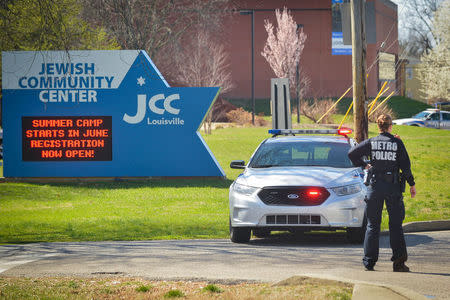 A police officer blocks an entrance as officials respond to a bomb threat at the Jewish Community Center in Louisville, Kentucky, U.S., March 8, 2017. REUTERS / Bryan Woolston