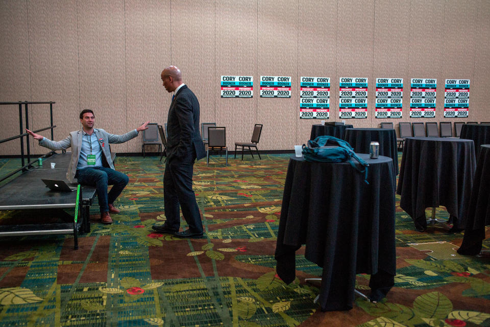 Booker speaks with Iowa State Director Mike Frosolone after a day of campaigning in the Grand Ballroom of the Cedar Rapids Double Tree Convention Complex following the Democratic Hall of Fame event on June, 9. | Danny Wilcox Frazier—VII for TIME