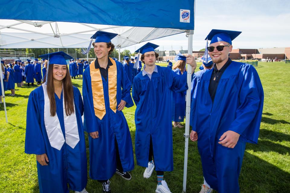 A group of seniors hangs out prior to the start of their graduation ceremony at Kennebunk High School  Sunday, June 5.