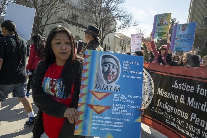 Lynette Craig marches with a poster of her brother who went missing in 2020 around the California State Capitol at the second annual Missing and Murdered Indigenous People Summit and Day of Action on Tuesday, Feb. 13, 2024 in Sacramento, California.