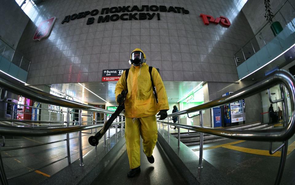 State employees disinfect the Leningradsky railway station in Moscow - Kommersant Photo Agency/Shutterstock 