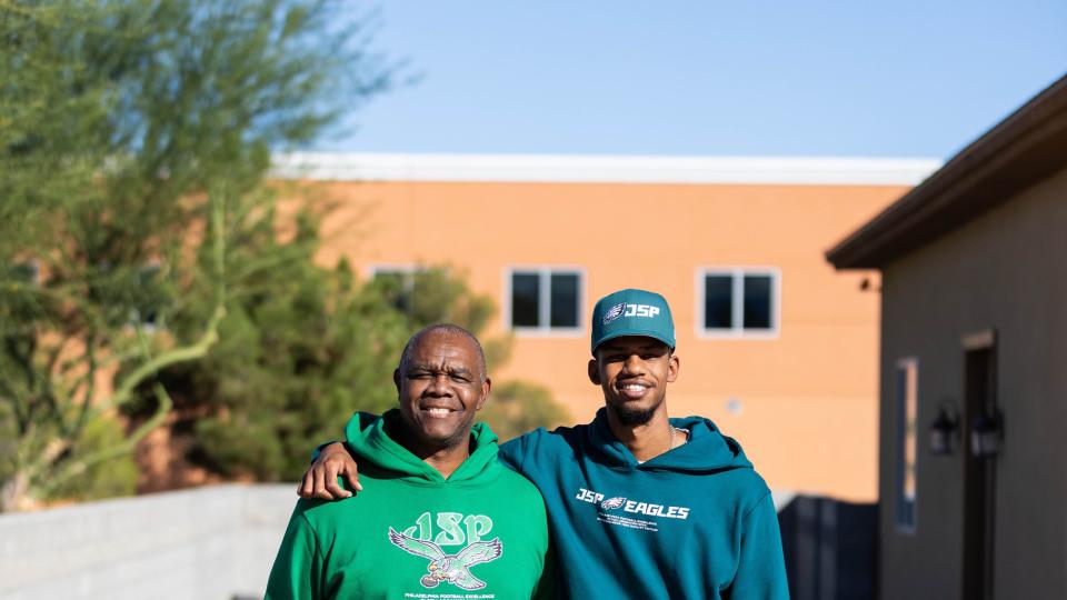 legendary eagles qb randall cunningham and his son, randall cunningham ii, in both iterations of the sweatsuit