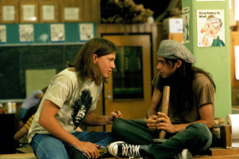 Rory Cochrane holding a wooden bong