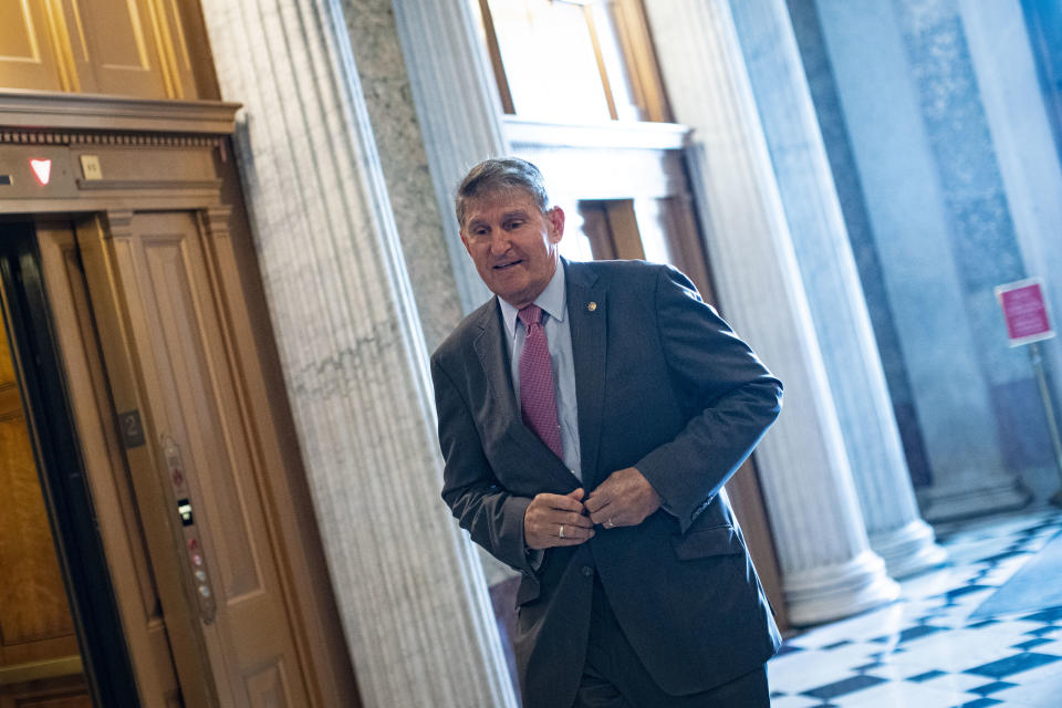 Senator Joe Manchin, a Democrat from West Virginia, wears a protective mask while walking to the Senate floor at the U.S. Capitol in Washington, D.C., U.S., on Friday, Oct. 23, 2020. (Al Drago/Bloomberg via Getty Images)