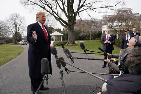 U.S. President Donald Trump talks to reporters as he departs on travel to Ohio at the White House in Washington, U.S., March 20, 2019. REUTERS/Kevin Lamarque